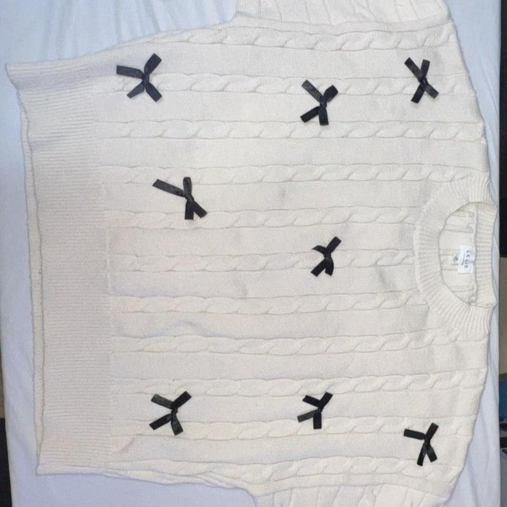 LeLis ivory sweater with black bows in a‎ size Medium